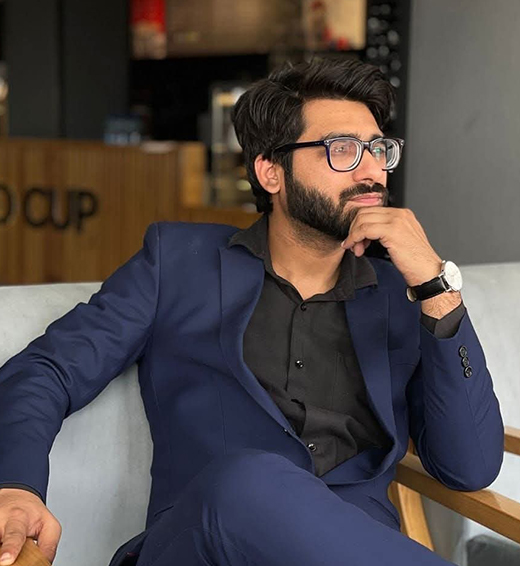 Portrait of Osama Khan, Managing Director at WREDD, creative leader and mentor